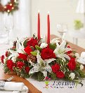 Counter table with red and white flowers with christmas candles